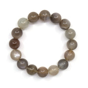 Overhead view of the chocolate moonstone bracelet, showing natural bands and colour variations in the round beads.