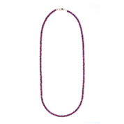 Natural ruby bead necklace with tiny faceted pink-red gemstones and a sterling silver clasp.
